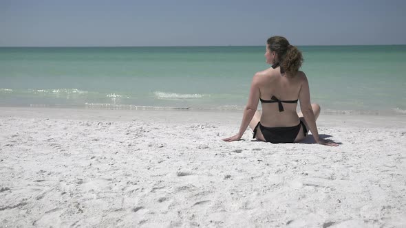 Woman Relaxing On A Morning Beach  (7 Of 9) alt