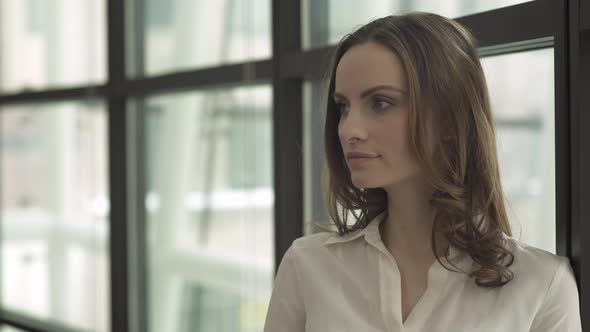 A Caucasian Woman Looks Into The Camera (2 Of 2) alt