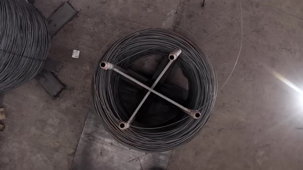 Steel reinforcement coils are wrapped using a special machine alt