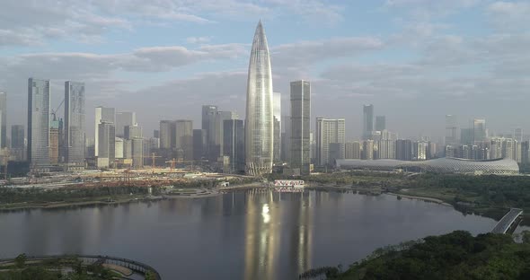 Aerial footage of migrant birds flying over sea and landscape in Shenzhen city,China alt