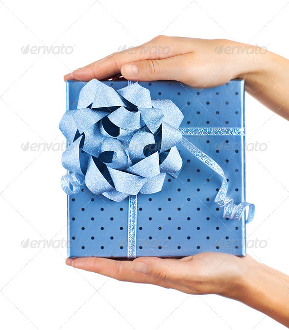 Female hands holding blue gift box - Stock Photo - Images