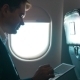 Man Using Tablet Computer During The Flight - VideoHive Item for Sale