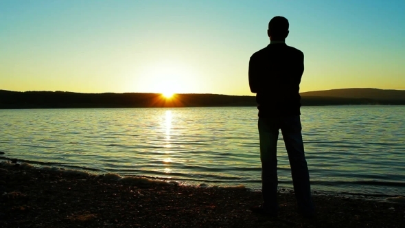 The Lonely Man Longs And Looks At A Sunset., Stock Footage | VideoHive