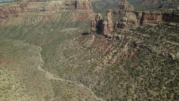 Drone Aerial 4K Colorado National Monument Valley in Summer with Large Red Rock Formations