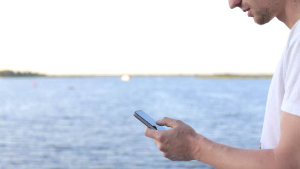 Man with a Touchscreen Phone alt
