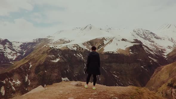 a Figure on Top in the Middle of the Mountains