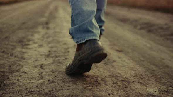 Rubber Boots Walking Rural Road Closeup at Countryside Alone alt