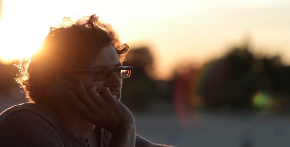 Man Talking On The Phone At Sunset alt