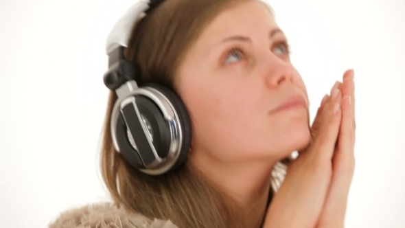 Portrait Of Pensive Young  Woman In Earphones