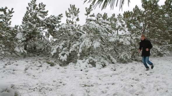 Happy Couple In Winter Forest. Slow Mo.