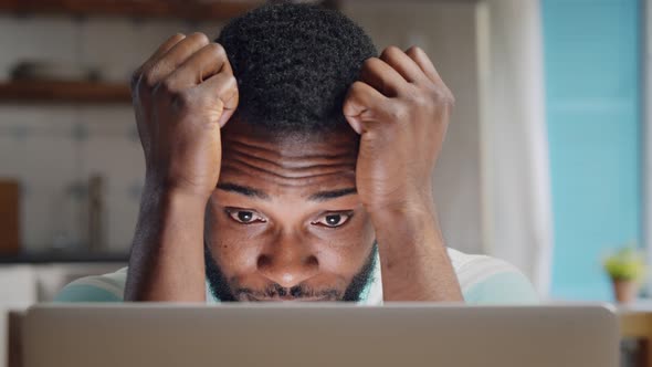 Depressed African Businessman Having Problems with Work Sitting at Home alt