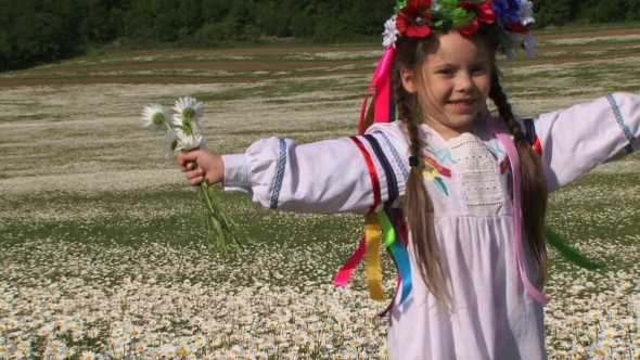 Cute Girl With Chamomiles Having Fun In The Field 