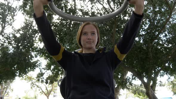 Young Woman Take a Training with Street Trainer