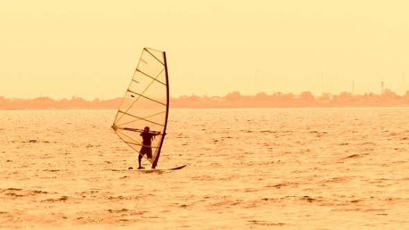 Windsurfer Slowly Sailing In The Black Sea 