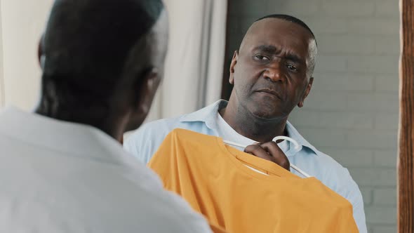 Stylish African American Senior Man Male Shopper Consumer Shopaholic Choosing Trending Outfit Stand alt