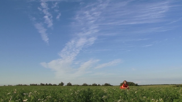 Beautiful Little Girl In Green Field 