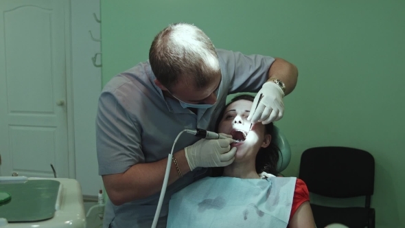 The Dentist Treats Tooth The Dentist Treats Tooth