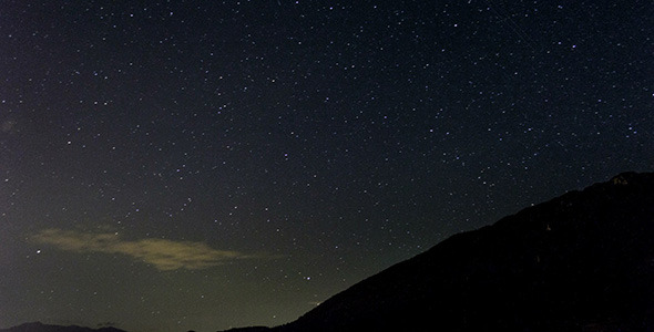 Stars Moving In Night Sky Over Mountain Ridge Stars Moving In Night Sky Over Mountain Ridge