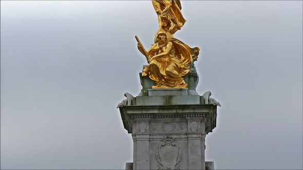 The Golden Statue of a Man with Wings Infront 
