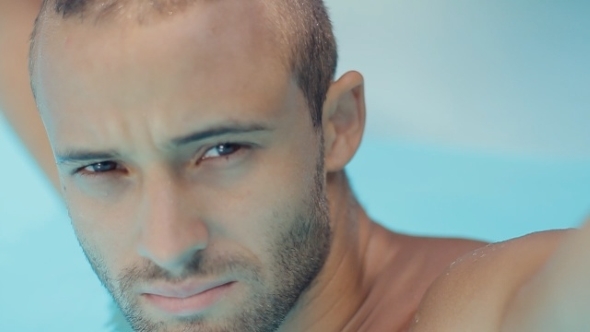 Sexy Naked Man With a Stubble In The Water In The