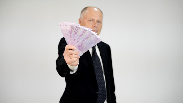 Old Businessman Showing Euro Banknotes alt