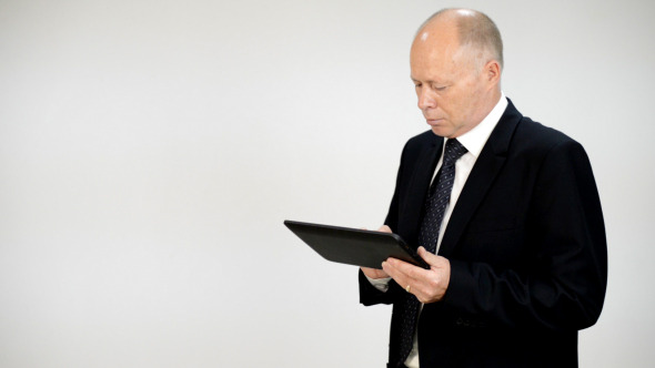 Businessman Typing on Tablet PC Businessman Typing on Tablet PC
