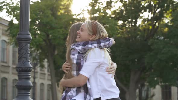 Two Happy Girlfriends Glad to Meet Each Other