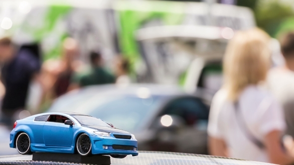 Girl Stroking A Toy Car