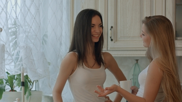 Two Smiling Girls Have Coffee Time Two Smiling Girls Have Coffee Time