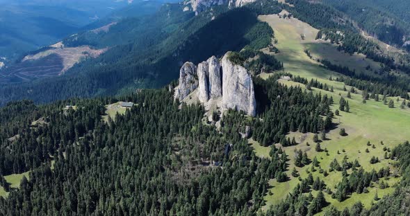 Bird's Eye View Of Unique Rock Formation Of The Loney Rock With Evergreen Forest At Daytime In Roman alt
