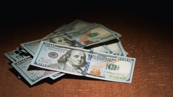 One Hundred Dollar Bills On The Table One Hundred Dollar Bills On The Table