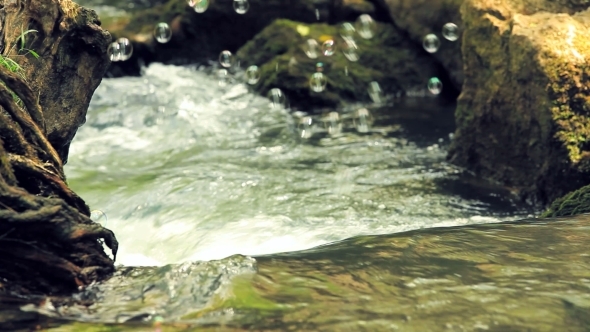 Soupbubbles Above Flowing Water Of River Stream alt