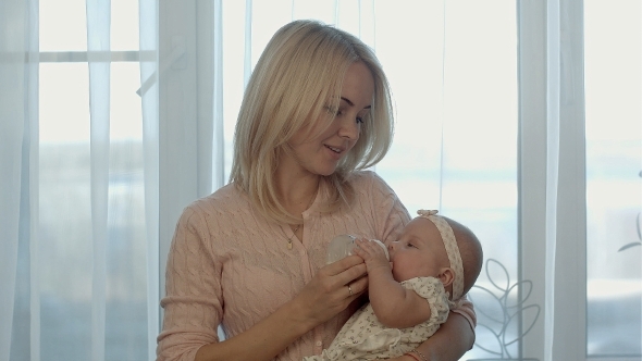 Mother Feeding a Baby Mother Feeding a Baby