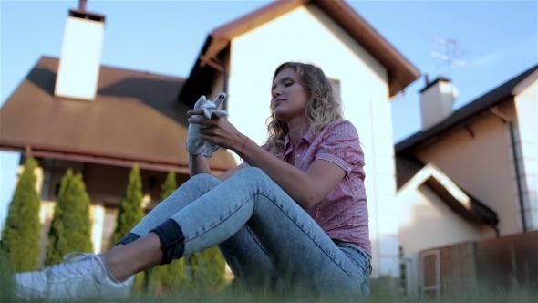 Beautiful Girl Sitting In The Yard Beautiful Girl Sitting In The Yard