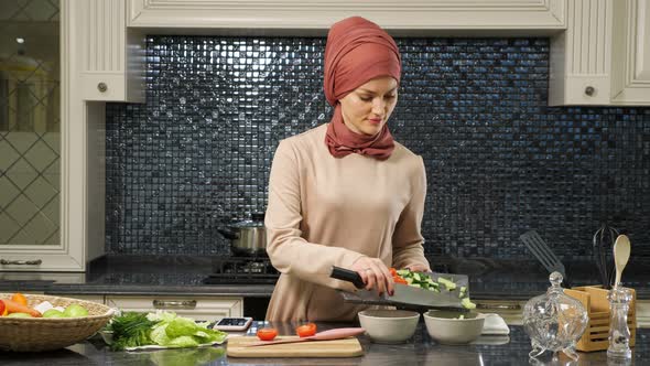 Attractive Housewife in Hijab Put Cut Fresh Vegetables in Deep Plates Preparing Halal Food alt