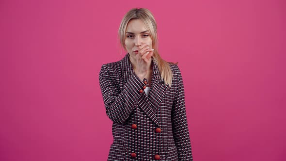 The Discreet Young Woman Looking at the Camera Shows the Gesture of Silence She Promises to Keep It alt