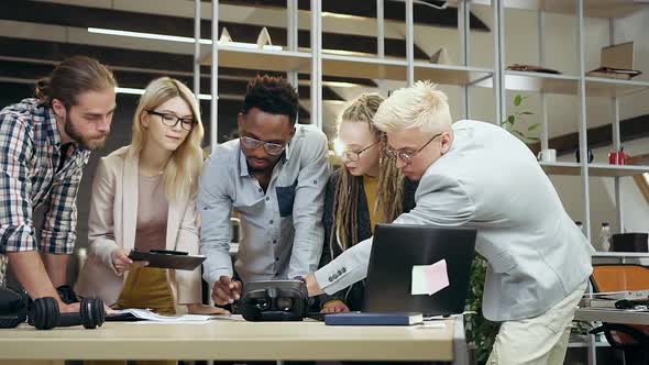 Team Working Together in Contemporary Office with Financial Datas and Information from Computer alt