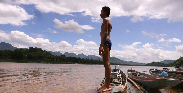 Kid Standing On A Boat Kid Standing On A Boat