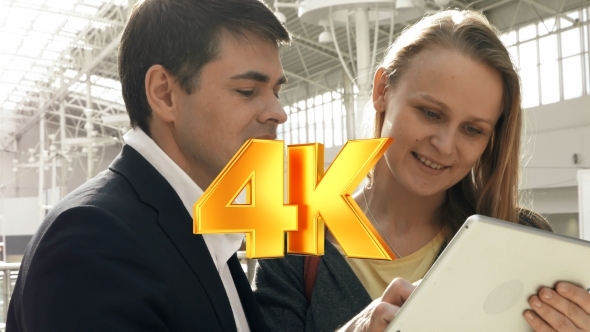 Young Happy Man And Woman Talking On Business With Young Happy Man And Woman Talking On Business With