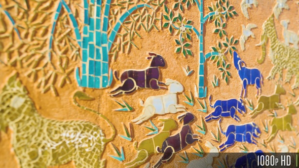 Religious Mosaic Carvings on the Outside Walls of Wat Xieng Thong Temple Laos alt