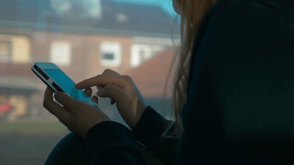 Woman Typing a Message On Smartphone Woman Typing a Message On Smartphone