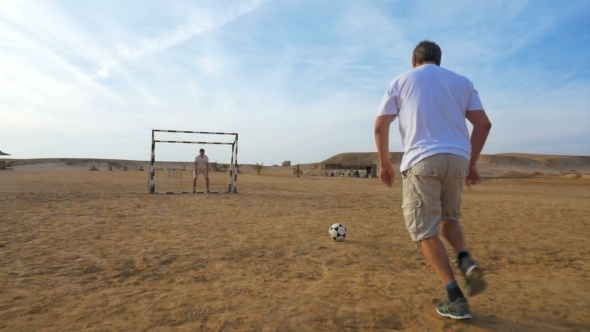 Man Shooting And Scoring In Friendly Match Man Shooting And Scoring In Friendly Match