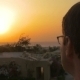 Man Putting On Spectacles To Enjoy The Sunset - VideoHive Item for Sale