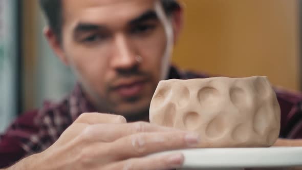 Closeup on Artist Hands Personalizing a Clay Cup Traditional Latin American Dishes Craftsman alt