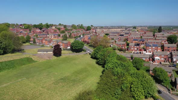 Aerial footage of the town of Batley in Yorkshire UK, showing a typical British housing estates