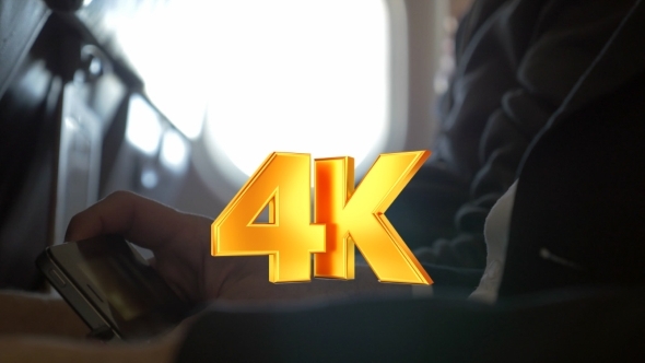 Man Watching Movie On Smart Phone In Plane Man Watching Movie On Smart Phone In Plane