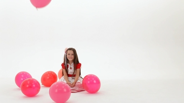 Girl Sits Among The Balloons