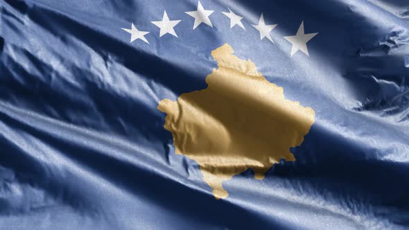 Kosovo textile flag waving on the wind. Slow motion. 20 seconds loop.  alt