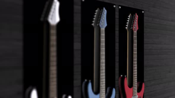 Three electric guitars hanging on a wall alt