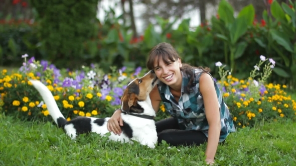 Woman Relaxing With Dog